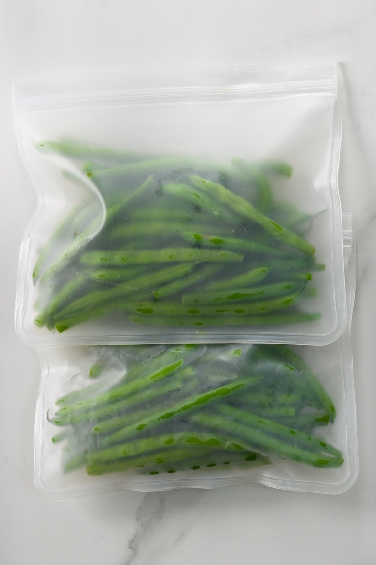 Two freezer bags with green beans