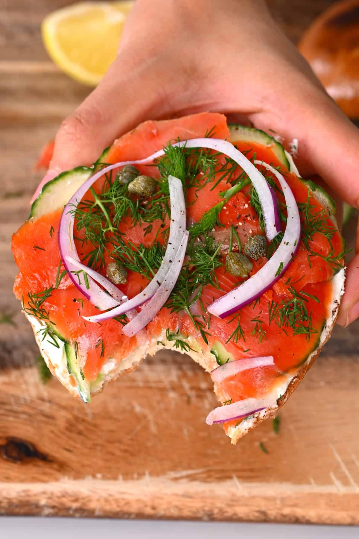 Lox bagel topped with dill capers and onion