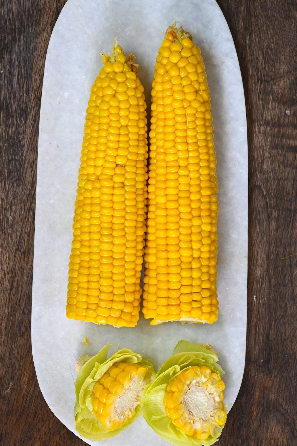 Two microwaved ears of corn