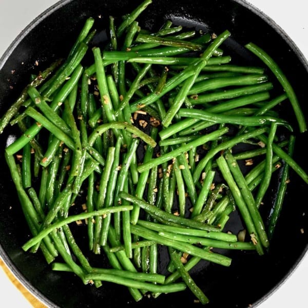 A pan with sautéed green beans