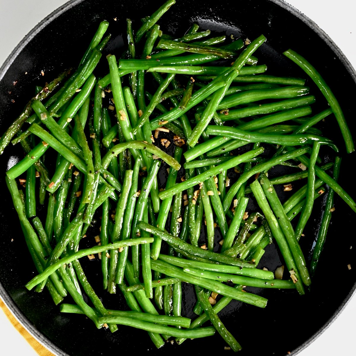 A pan with sautéed green beans