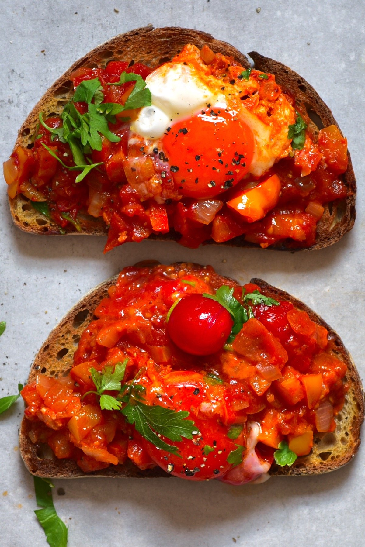Two toasts topped with shakshuka