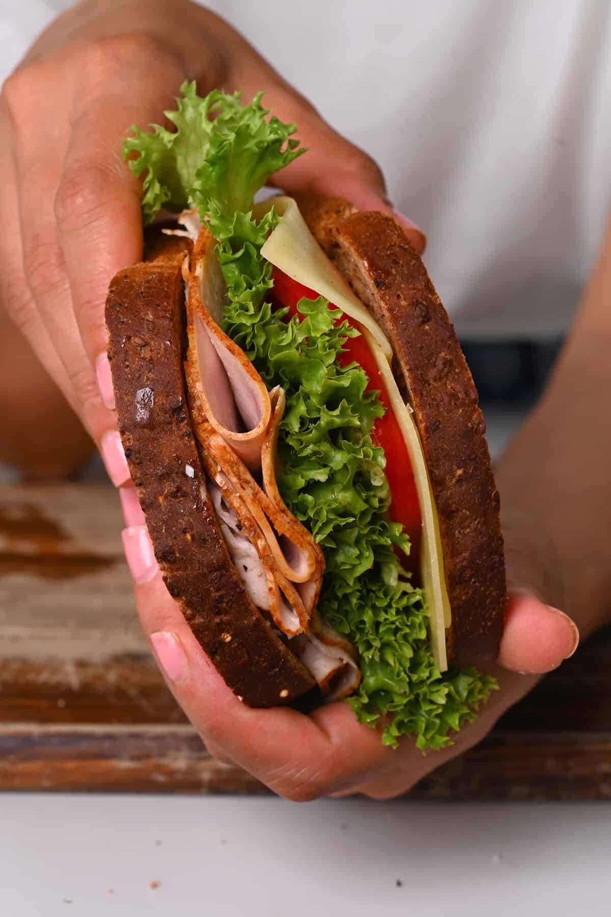 A turkey sandwich with tomato and lettuce