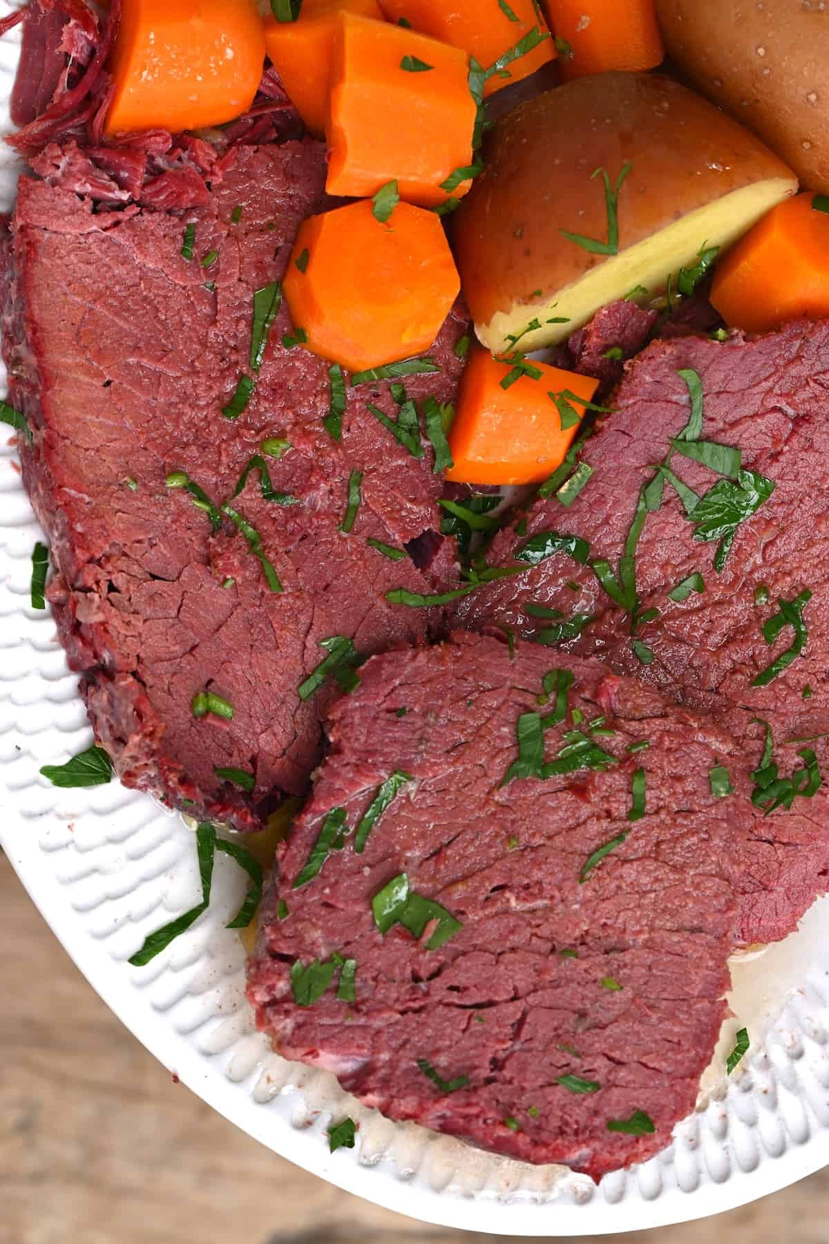 Slices of corned beef cooked with carrots