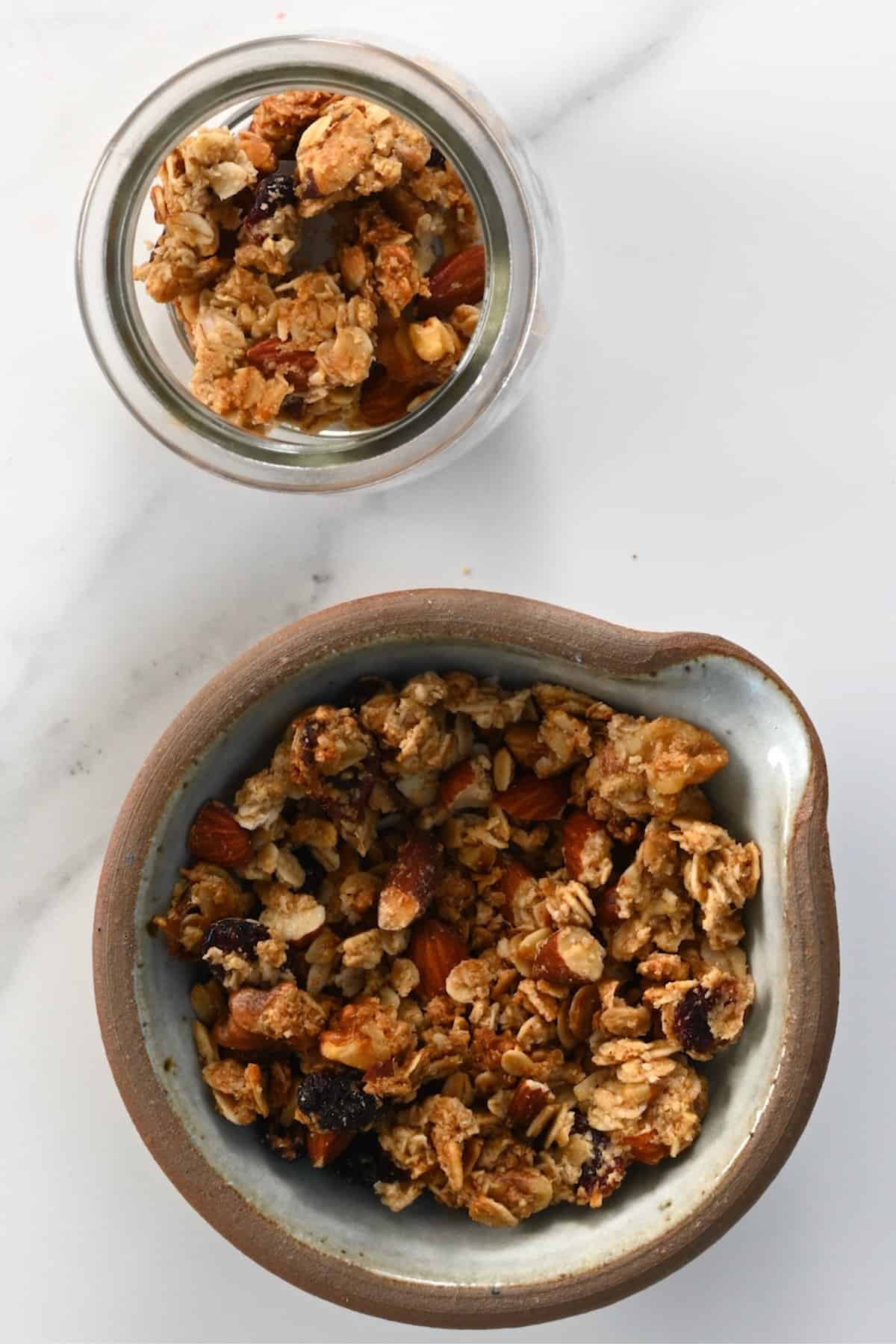 Healthy homemade granola in a bowl and in a small jar