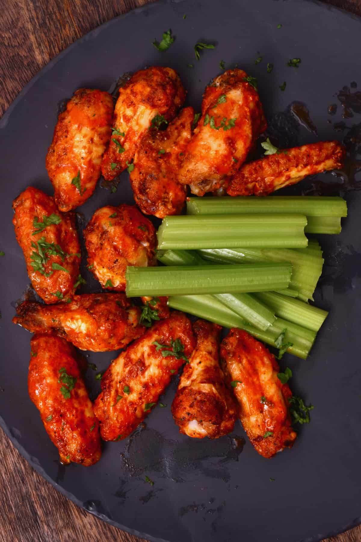 Buffalo sauce chicken wings and celery