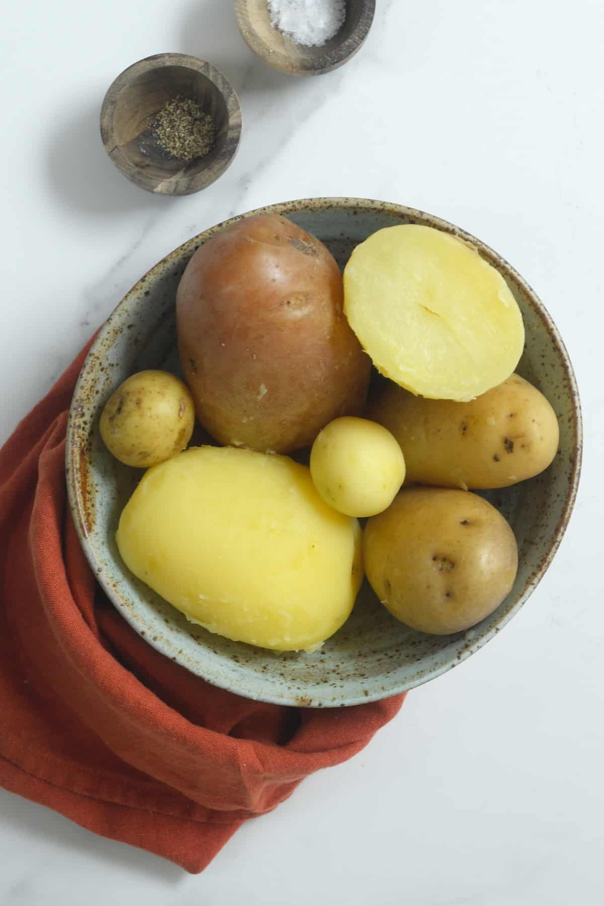 Boiled whole and halved potatoes