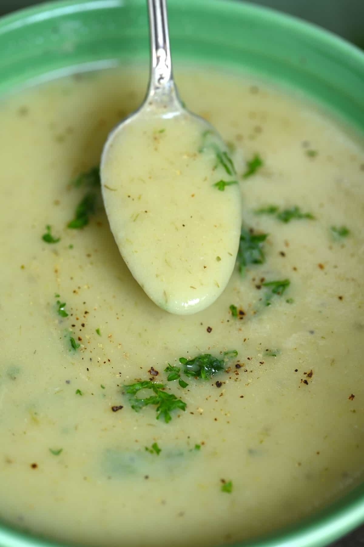 A spoonful of homemade leek potato creamy soup