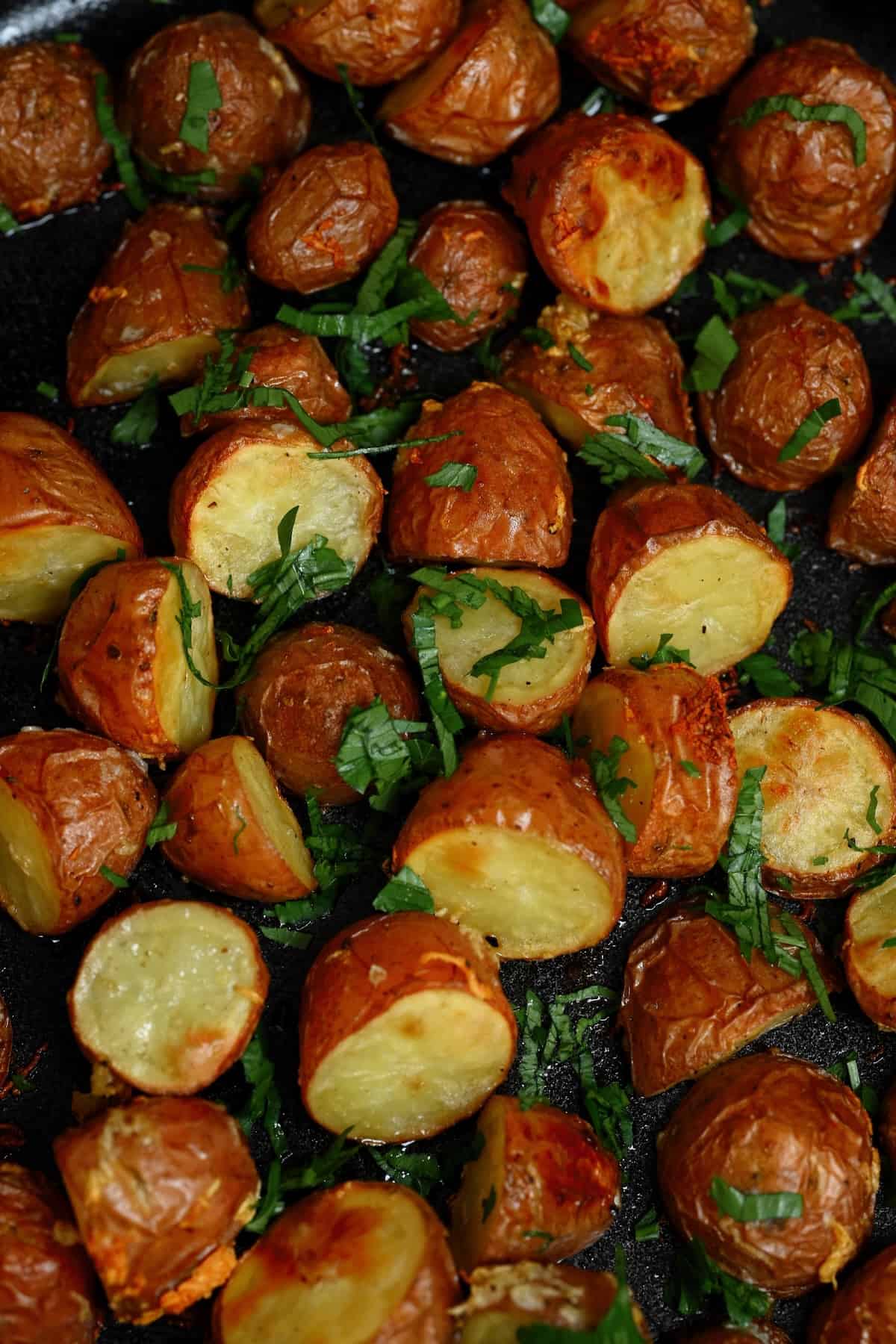 A close up of roasted new potatoes