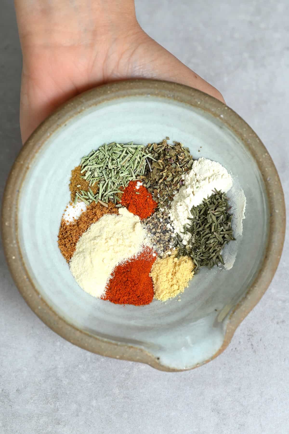 A bowl with spices for chicken seasoning