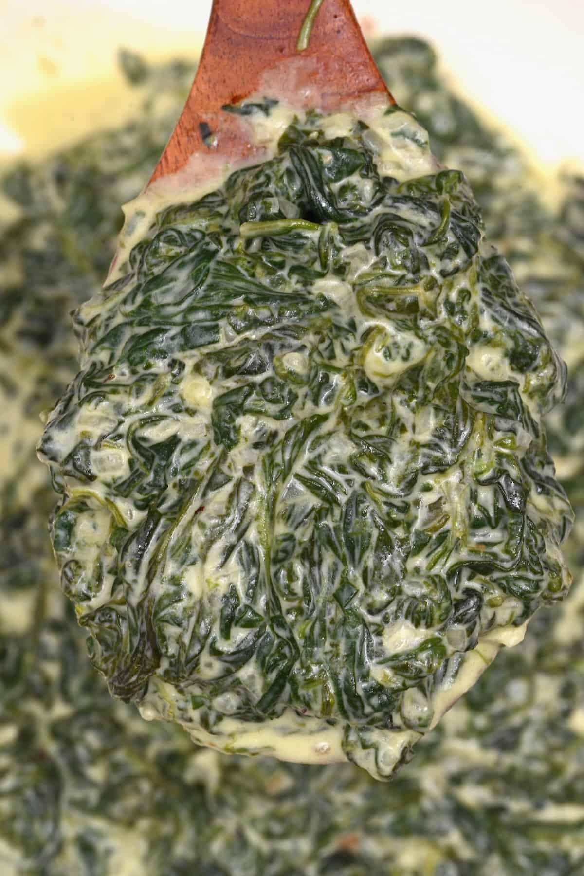 A spoonful of homemade creamed spinach