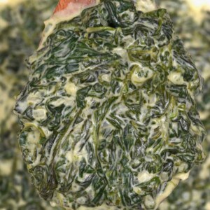 A spoonful of homemade creamed spinach