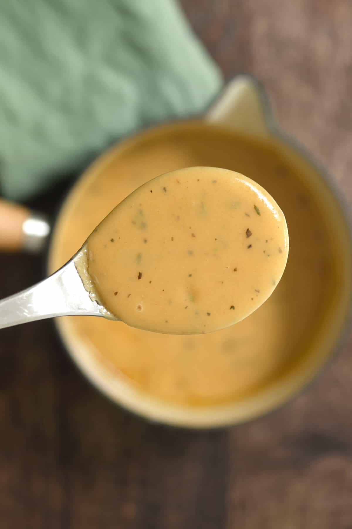 A spoonful of homemade brown chicken gravy