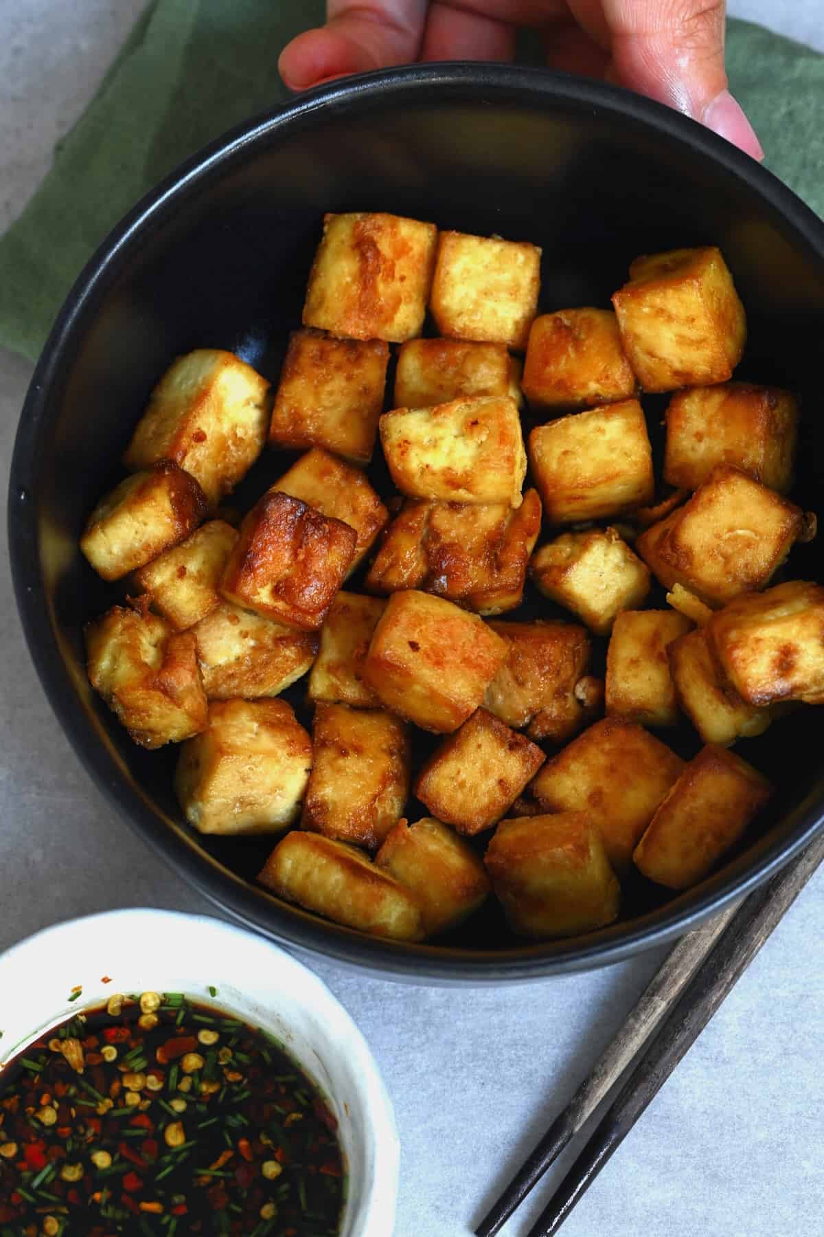 A bowl with baked crispy tofu
