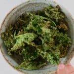 A bowl with homemade kale chips