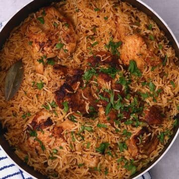 One pot chicken and rice on a flat surface
