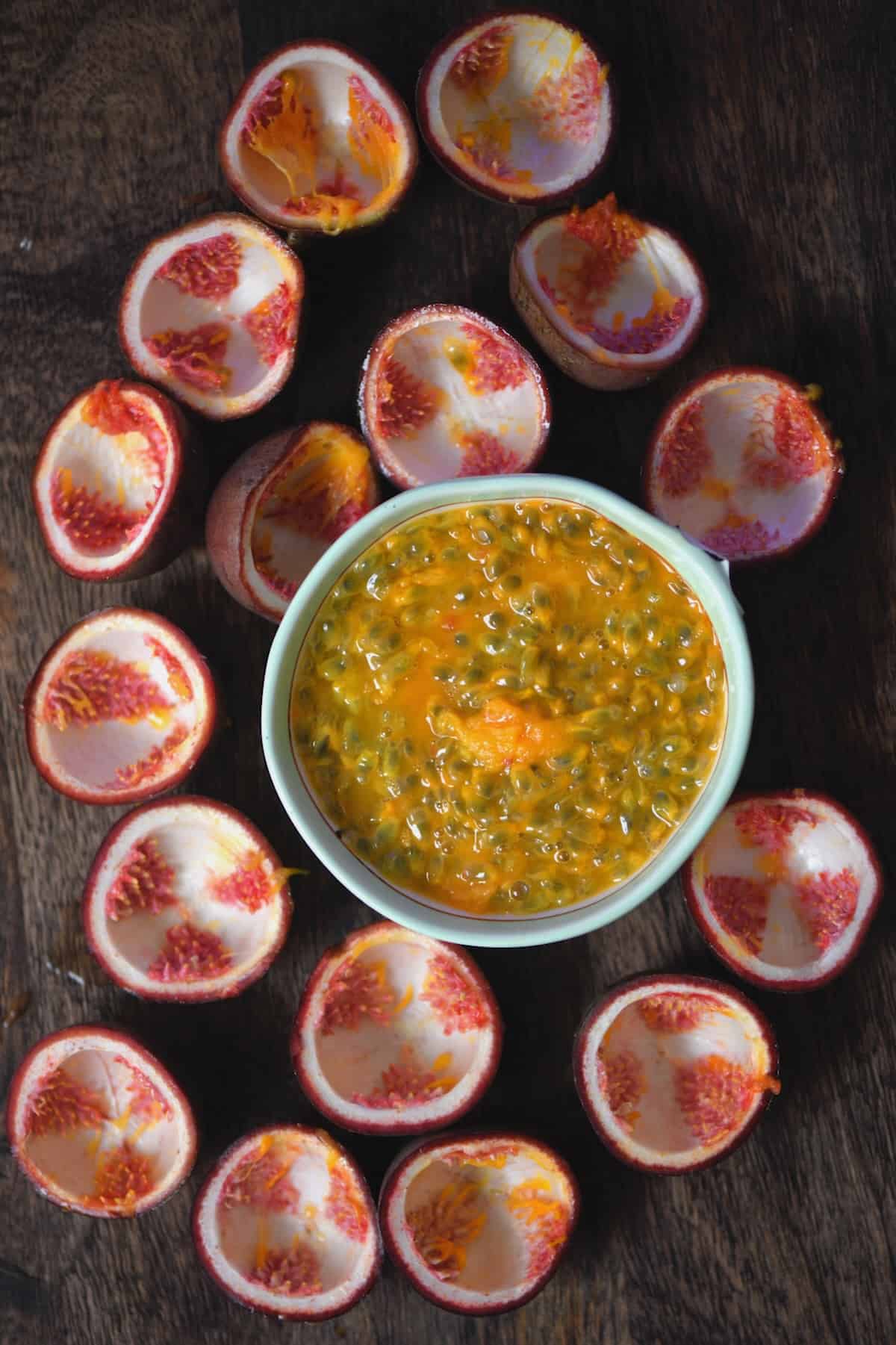 The flesh of eight passion fruit in a bowl