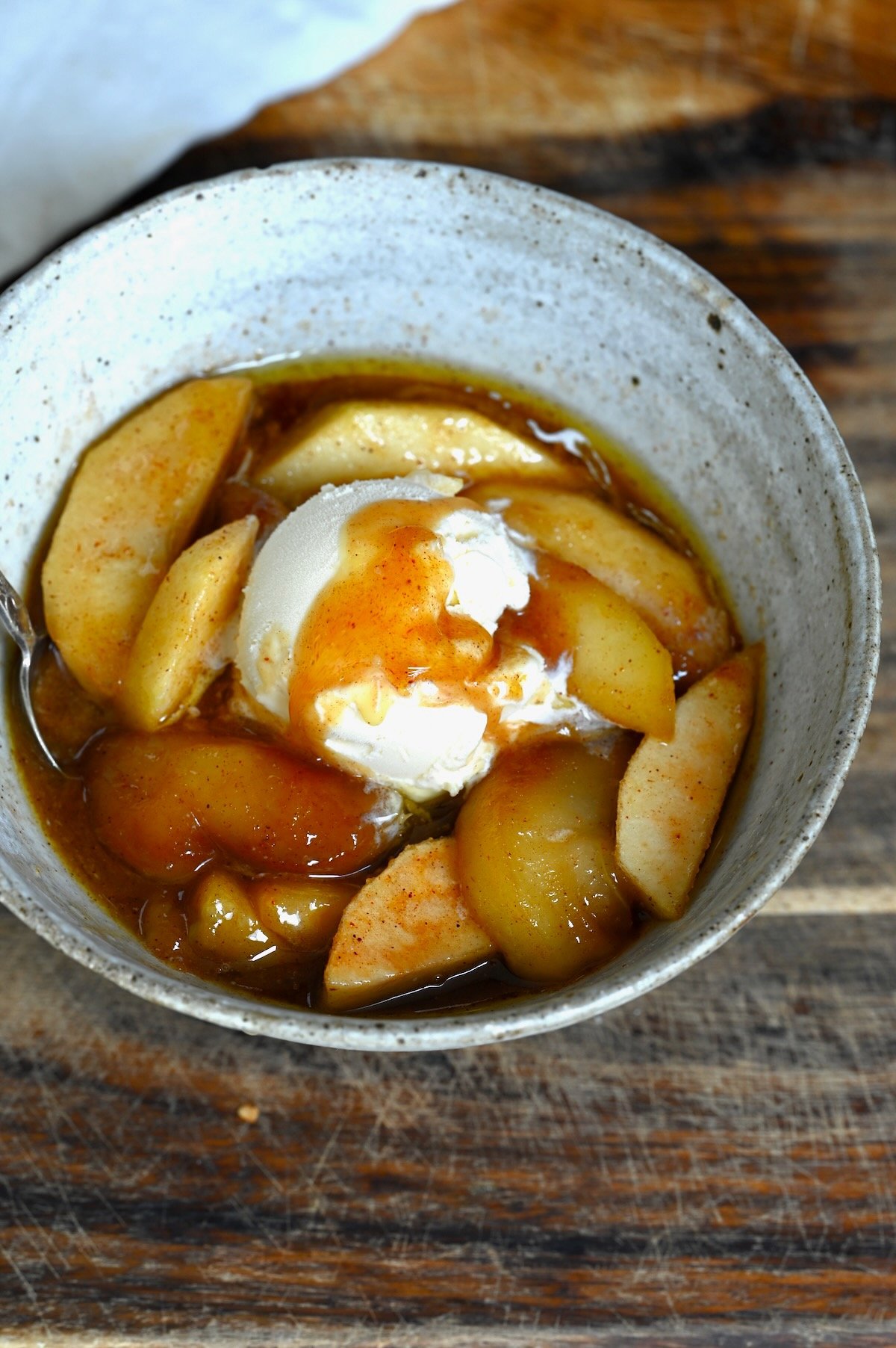 Fried apples topped with ice cream