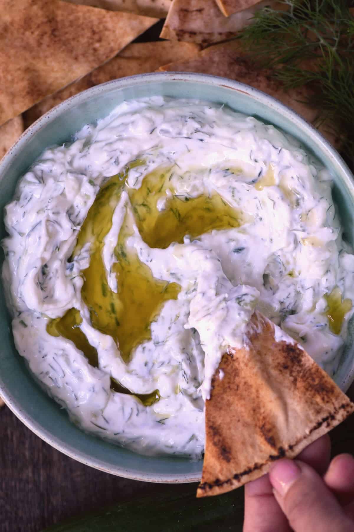 Homemade tzatziki in a bowl with pita chips