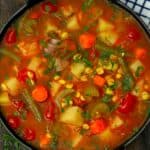 A serving bowl with vegetable soup - 12