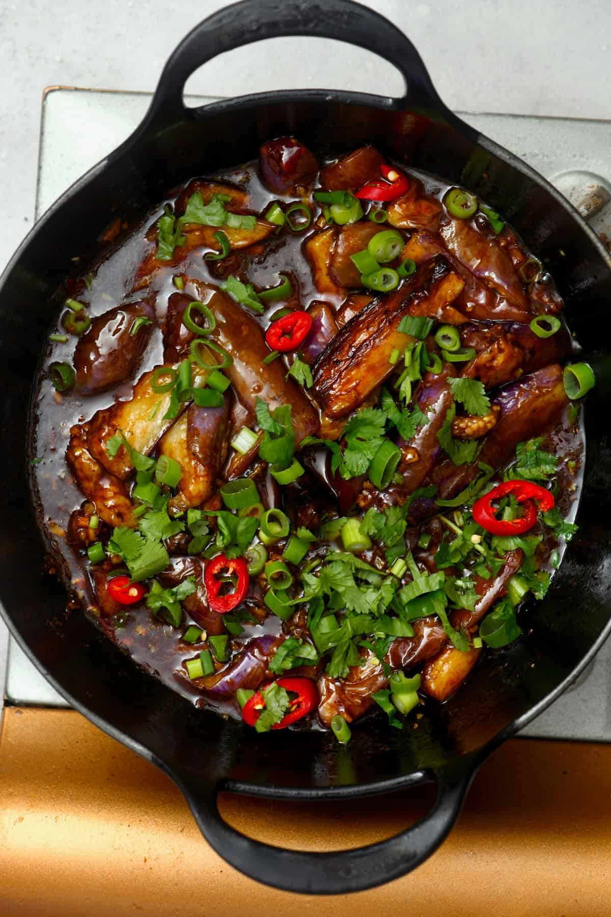 Chinese eggplant stir fry in a wok
