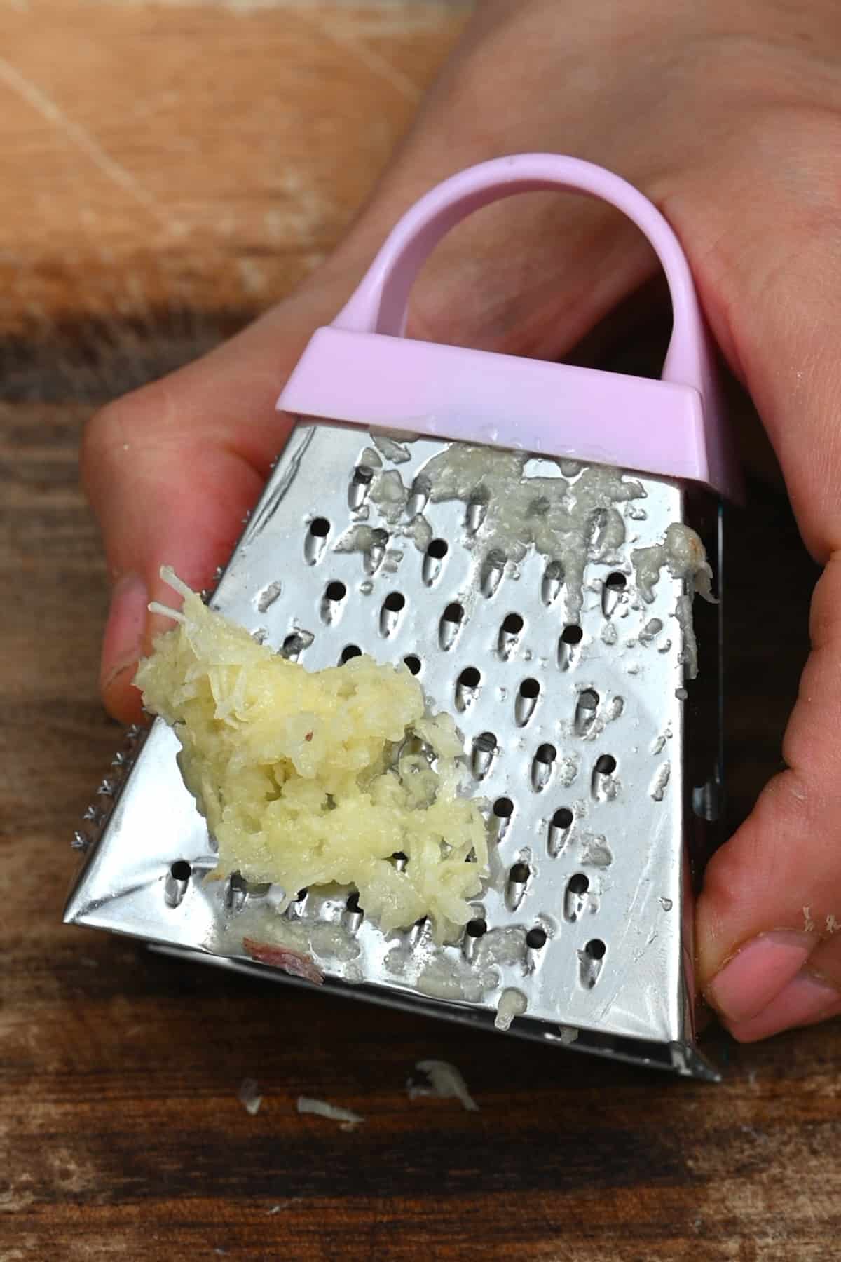 Grated garlic on a box grater