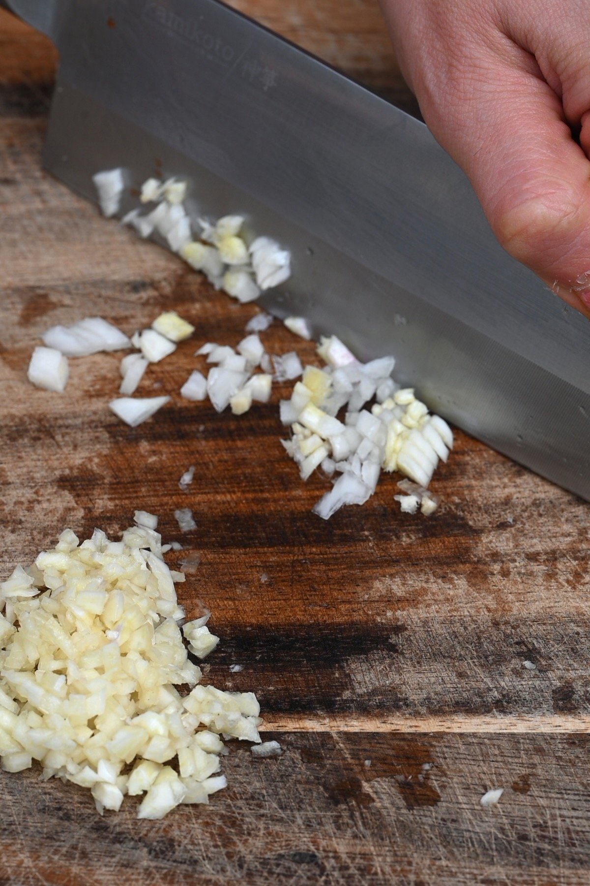 Mincing garlic with a knife