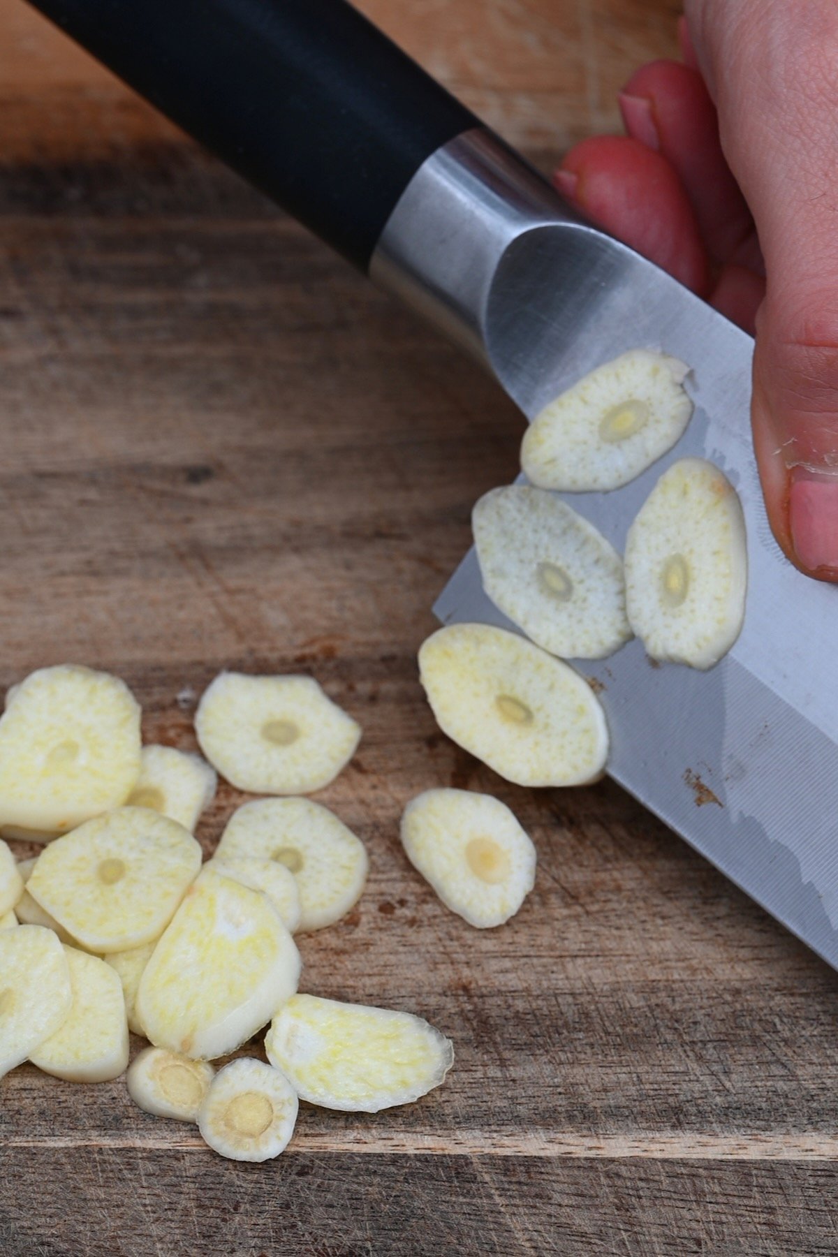 Slicing garlic with a knife