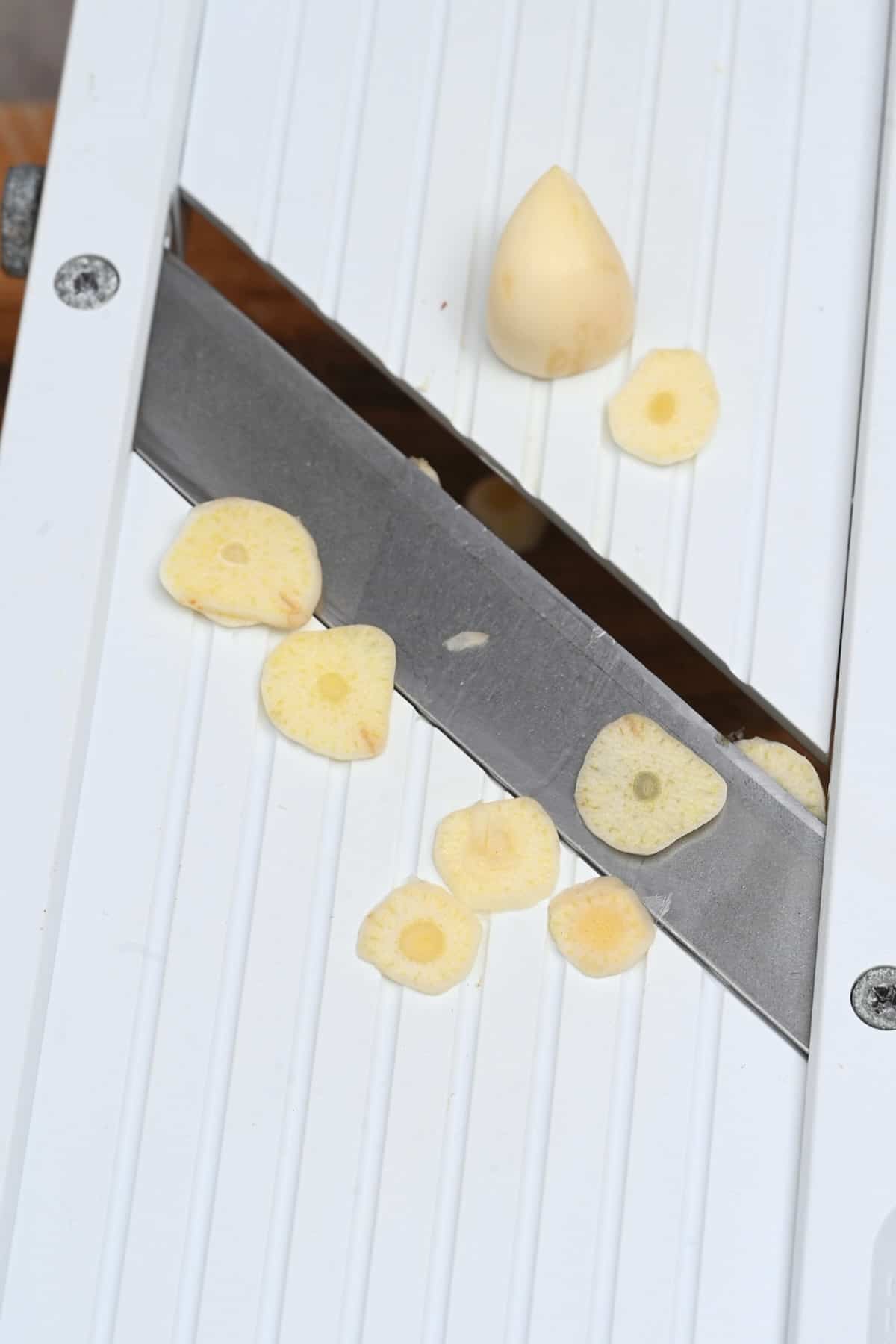 Slicing garlic with a mandolin