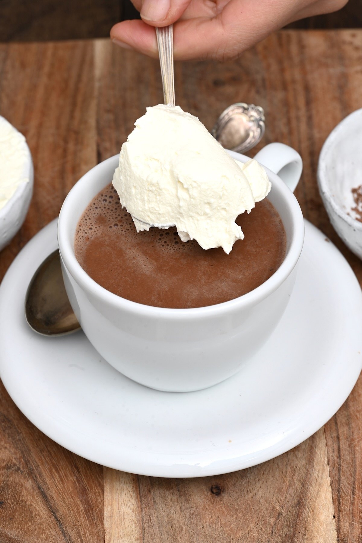 Topping hot cocoa with whipped cream