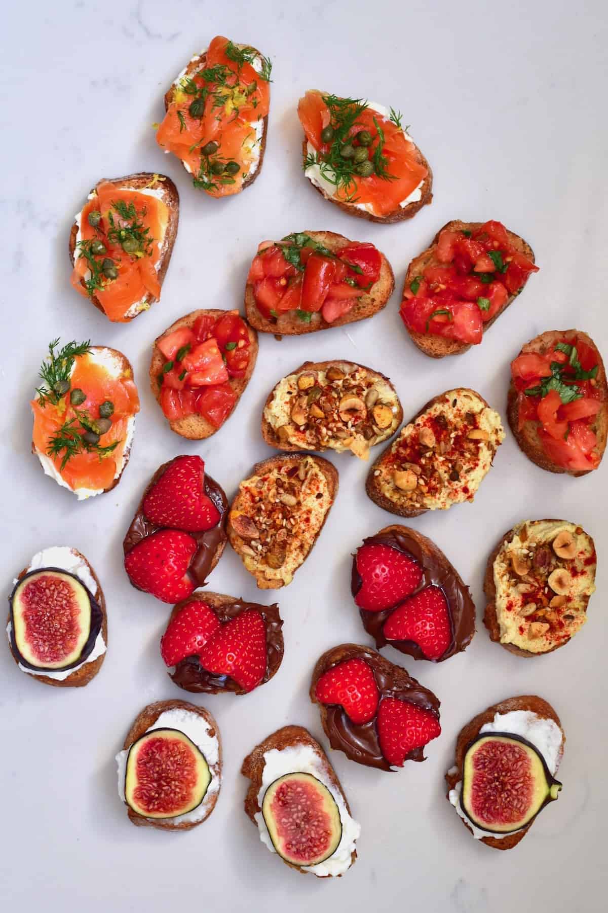 Different toppings on homemade crostini dried bread