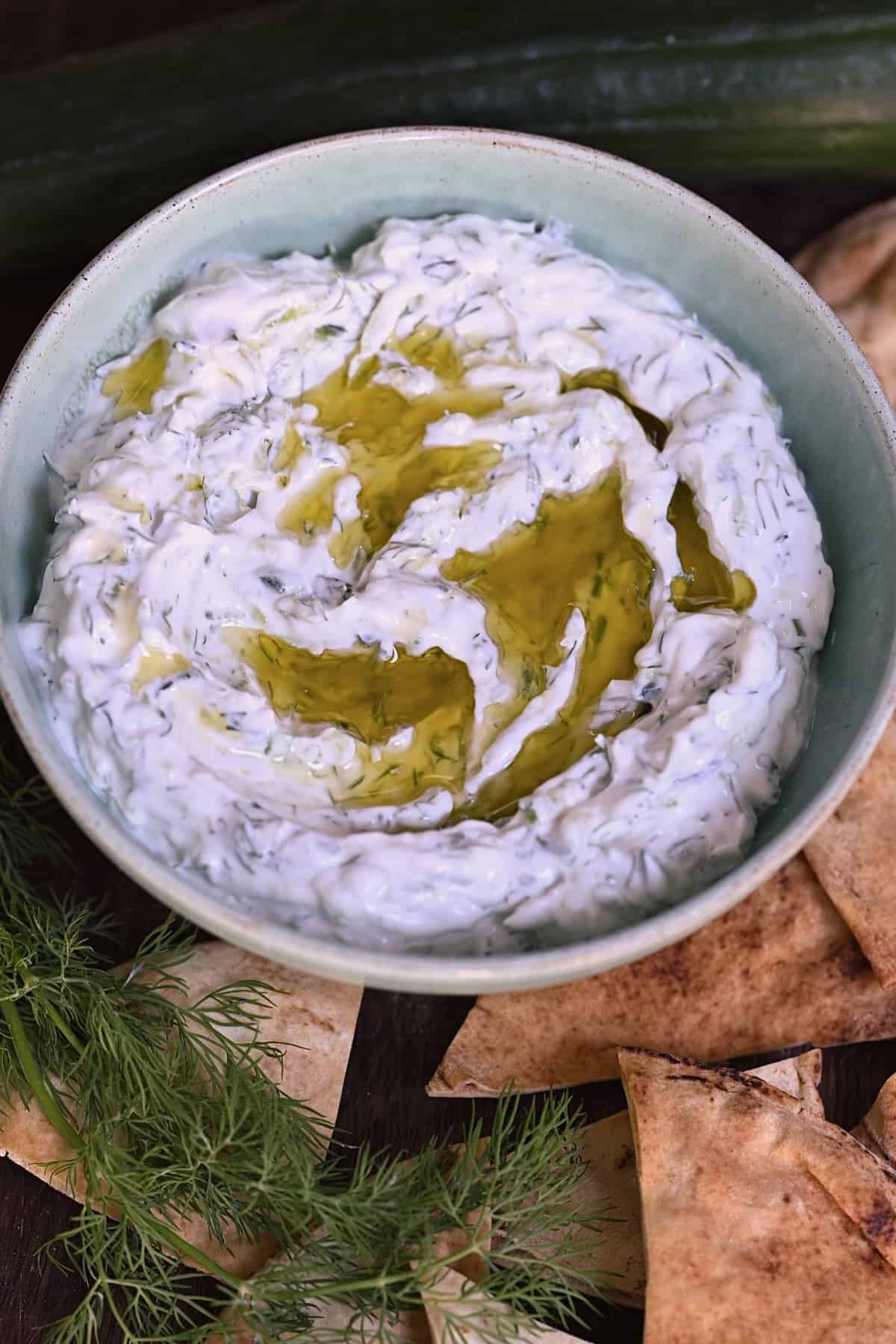 A bowl of homemade tzatziki topped with a bit of oil