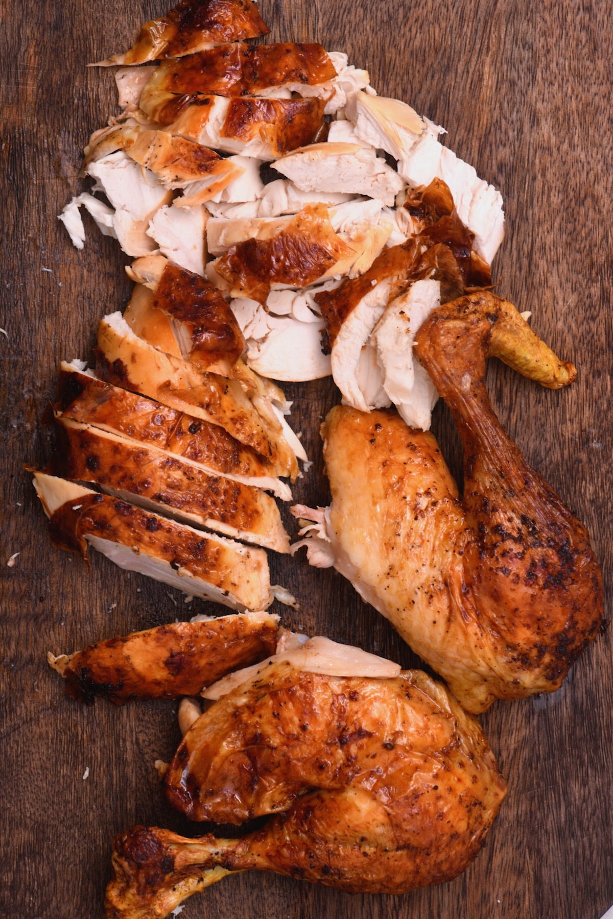 Carved oven roasted chicken on a cutting board