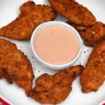 A serving of air fried frozen chicken tenders and cane's sauce - 10