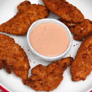 A serving of air fried frozen chicken tenders and cane's sauce