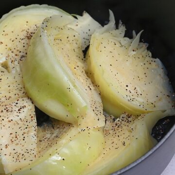 Cabbage topped with pepper in a pot
