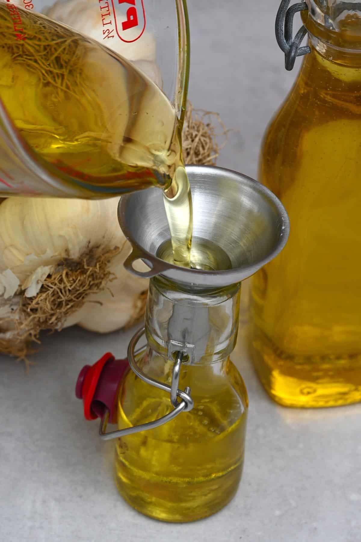 Pournig garlic oil in a small bottle