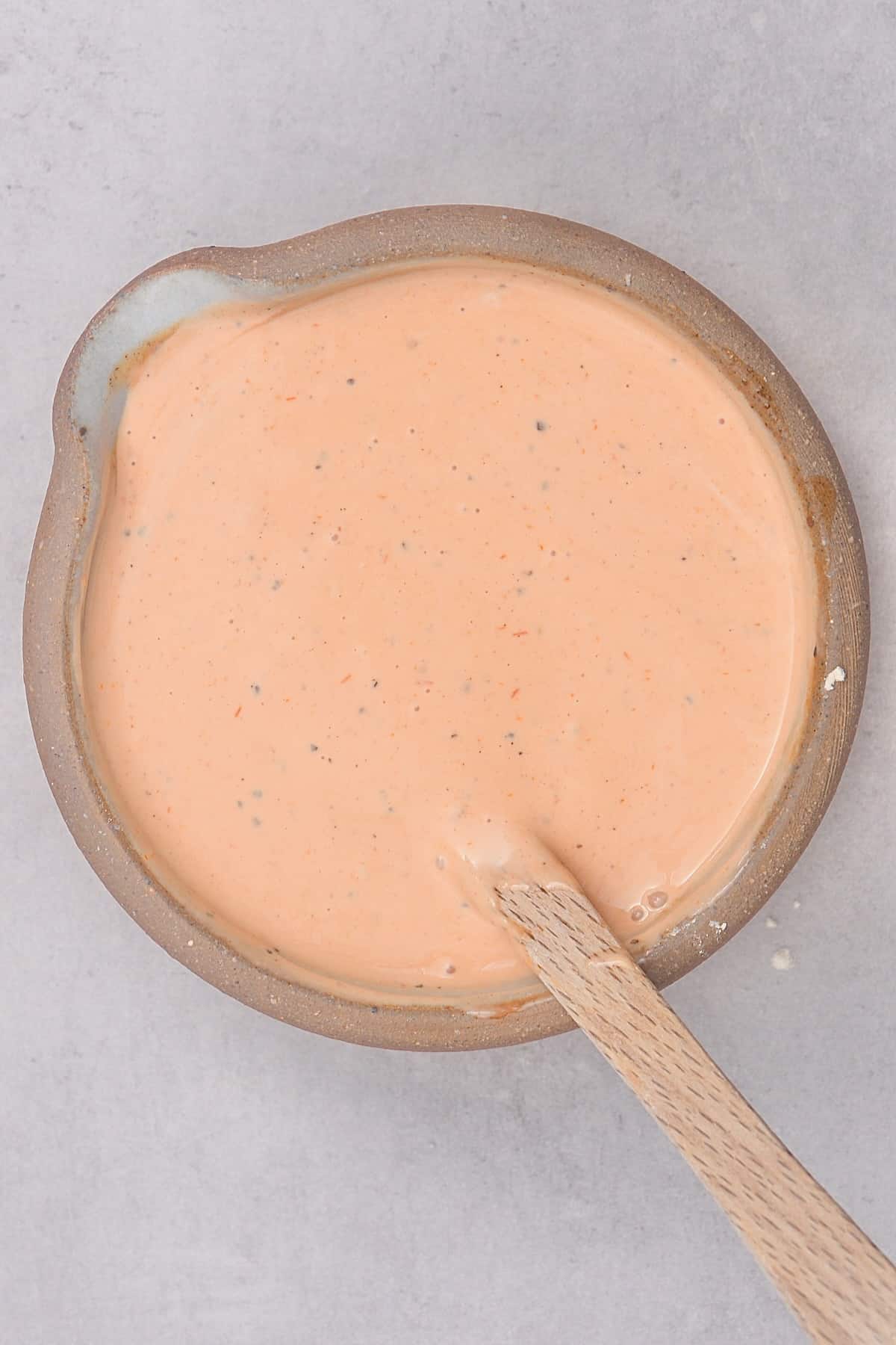 A bowl with homemade Raising Cane's sauce