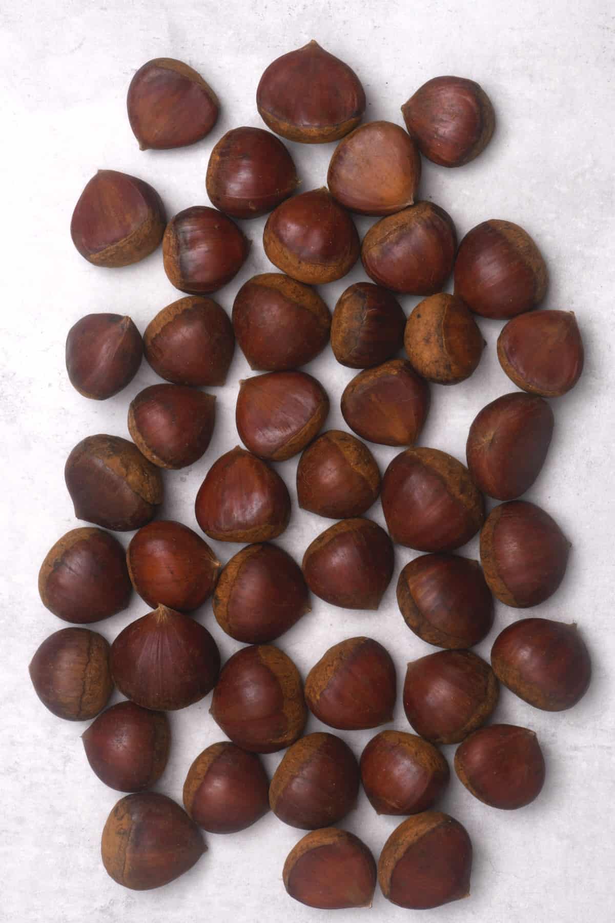 Sweet chestnuts on a flat surface