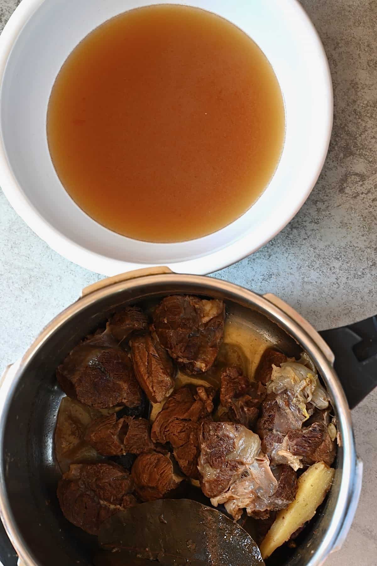 Homemade beef broth and cooked meat