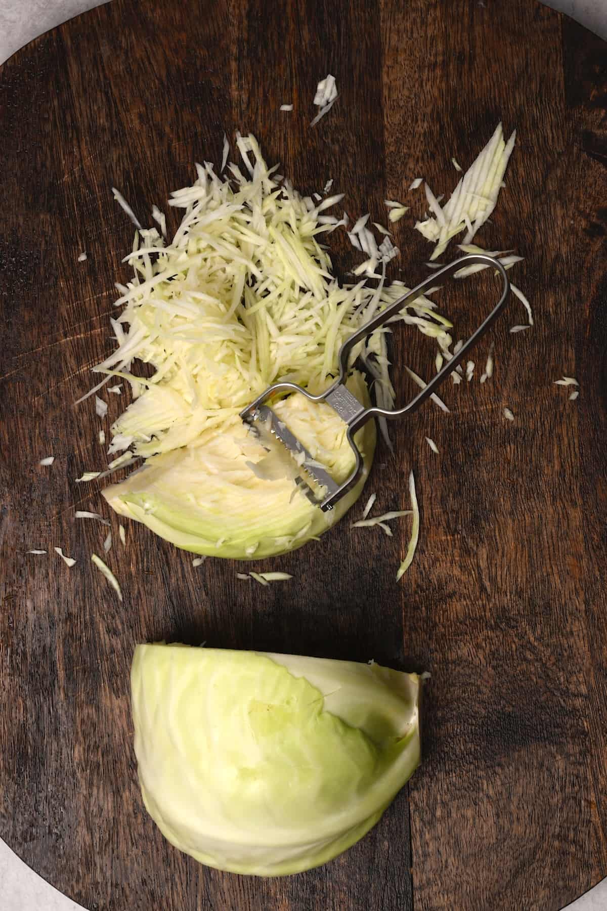 Shredding cabbage on a chopping board