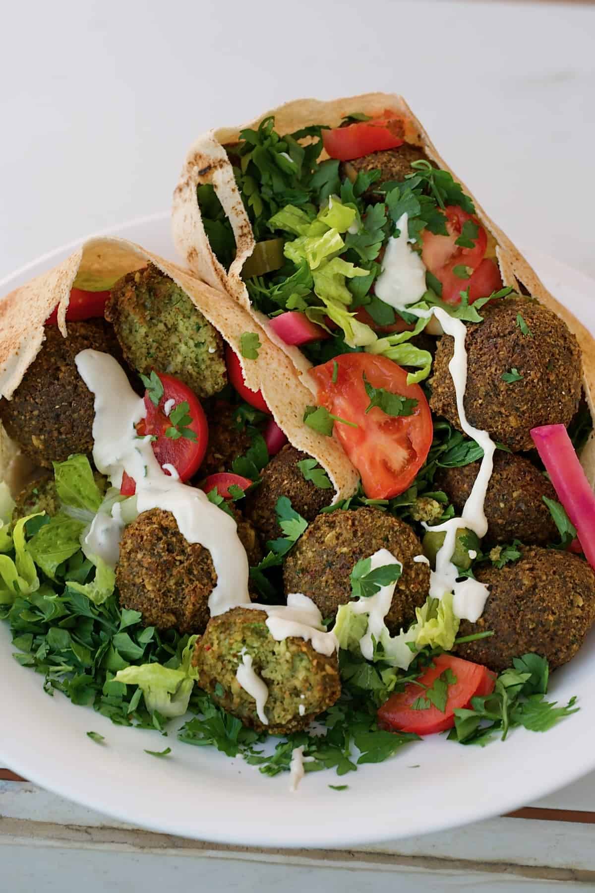 A meal made of falafel and veggies