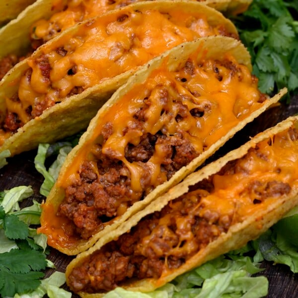 Ground beef tacos topped with melted cheese