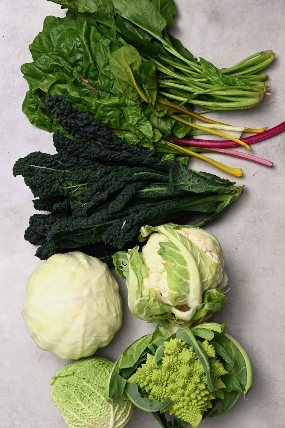 Different types of brassica vegetables on a flat surface