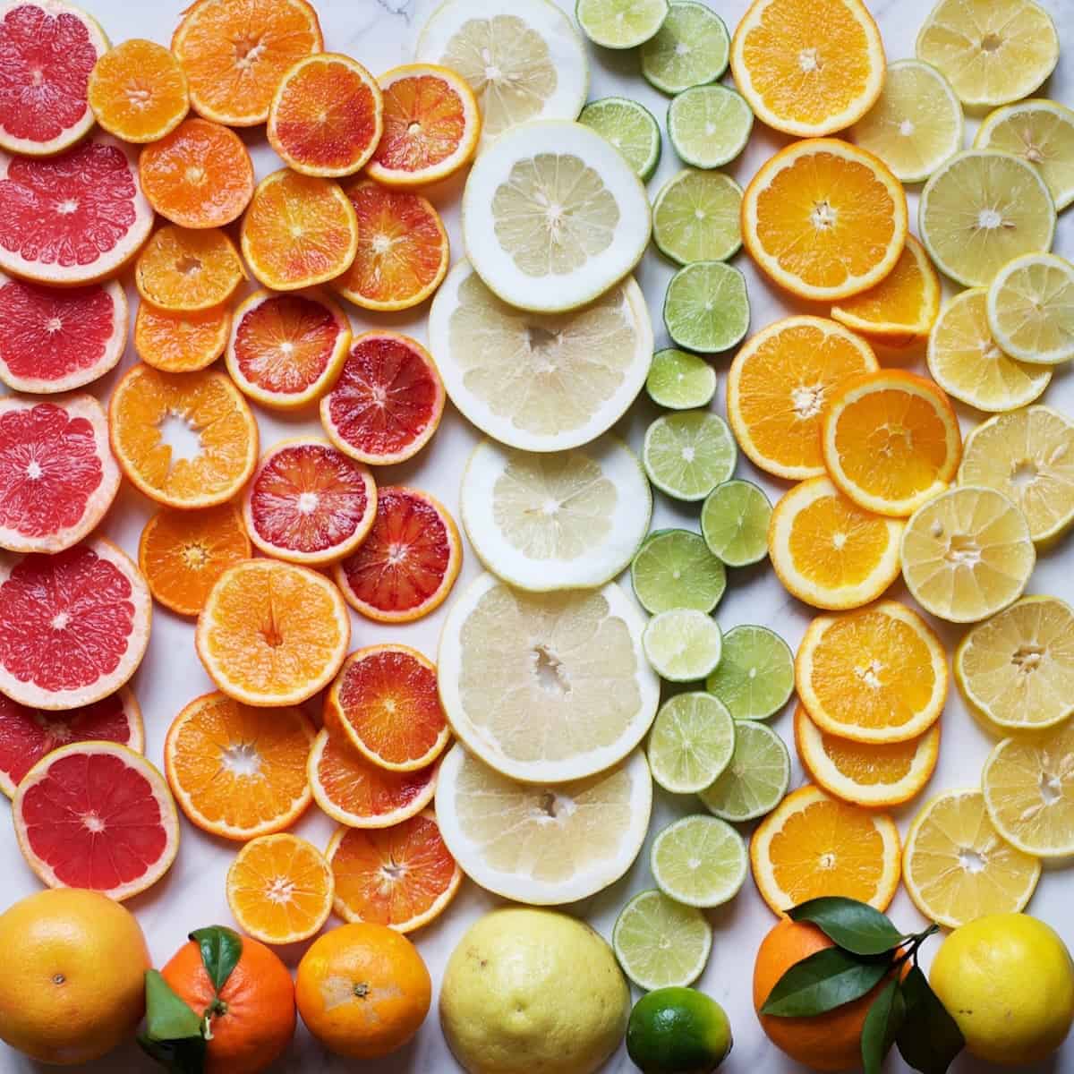 Different types of citrus cut into slices