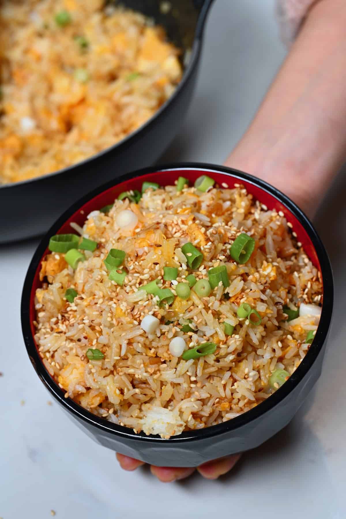 A bowl with eggs fried rice