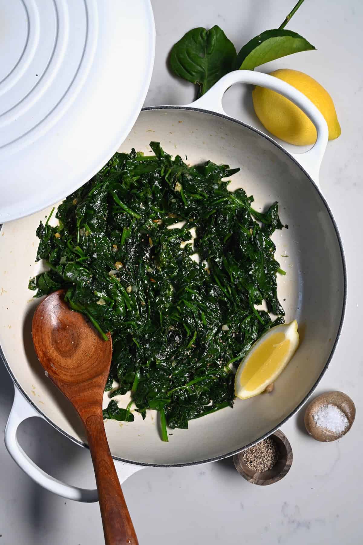 A pan with sauteed spinach