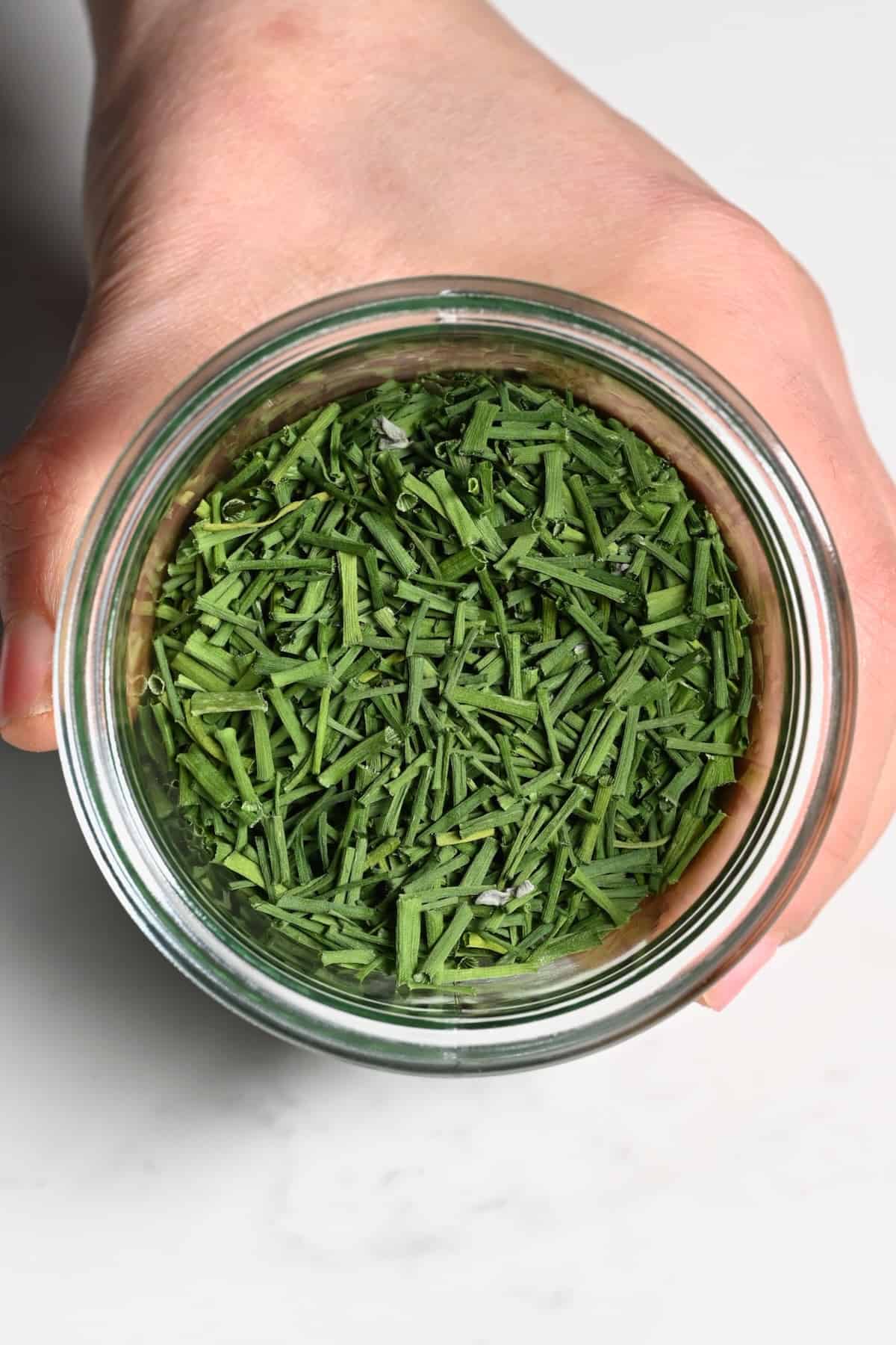 A small jar with dried chives