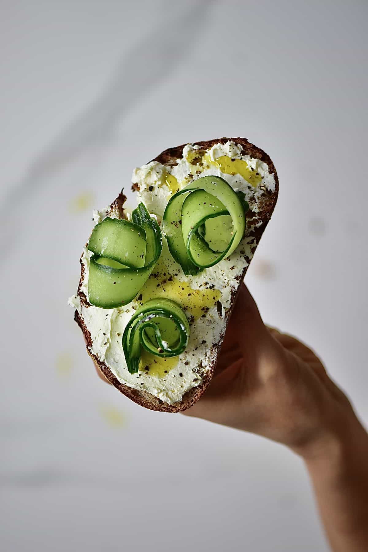 Labneh sandwich topped with cucumber