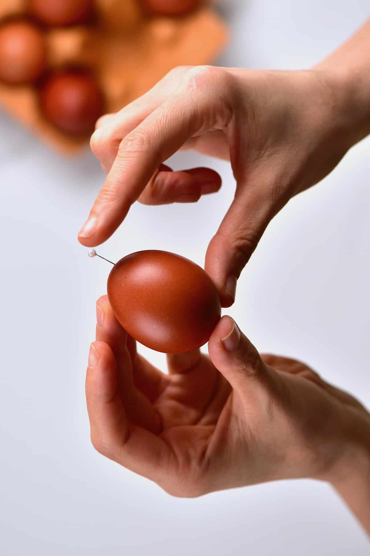 Pricking an egg